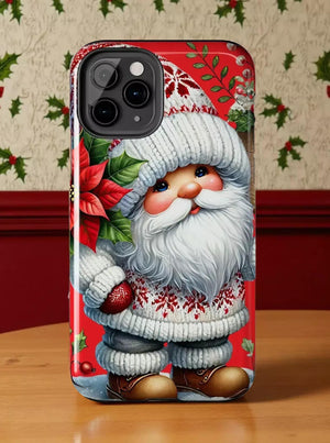 A phone case featuring a Christmas-themed design with a smiling Santa Claus figure wearing a white hat and sweater, holding a poinsettia plant.