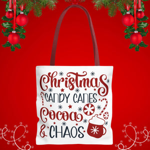 A white tote bag with a festive Christmas-themed design, featuring text and illustrations related to holiday treats and decorations.