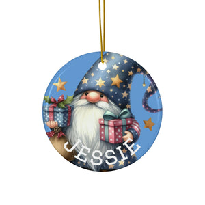 A round ornament featuring a gnome holding presents and surrounded by stars.