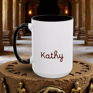 A white ceramic mug with a black handle, featuring the name "Kathy" printed in red text on the front.