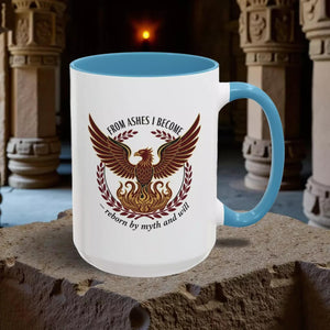 A white mug with a blue handle, featuring a graphic design of a phoenix with wings spread wide, surrounded by a laurel wreath.