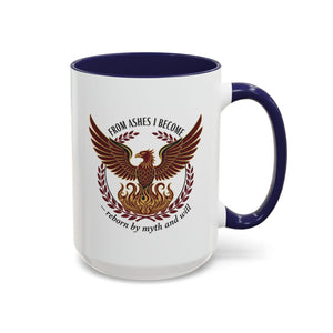 A white mug with a blue rim, featuring a graphic design of a phoenix with wings spread wide, surrounded by a laurel wreath.