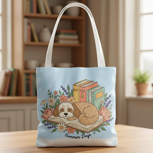 A tote bag with a printed design depicting a sleeping dog surrounded by flowers and books, with the text "Summer Days" below the image.
