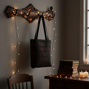 A tote bag with a printed design of a bookshelf filled with books.