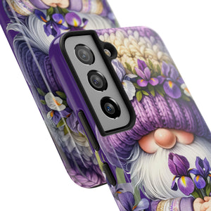 a phone case with a purple and white floral design, including a gnome or gnome-like character wearing a knitted hat and holding flowers.
