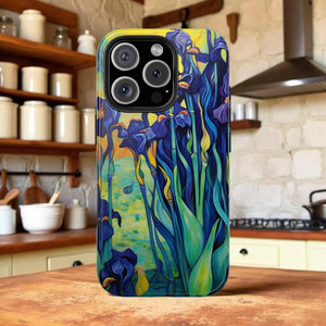 a colorful phone case with a vibrant floral design, placed on a wooden surface in a kitchen setting.
