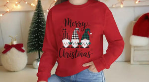 A woman wearing a red sweater with a Christmas-themed design and text, smiling at the camera.
