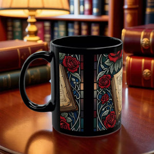 A black coffee mug with a colorful stained glass design featuring red roses and other floral elements.