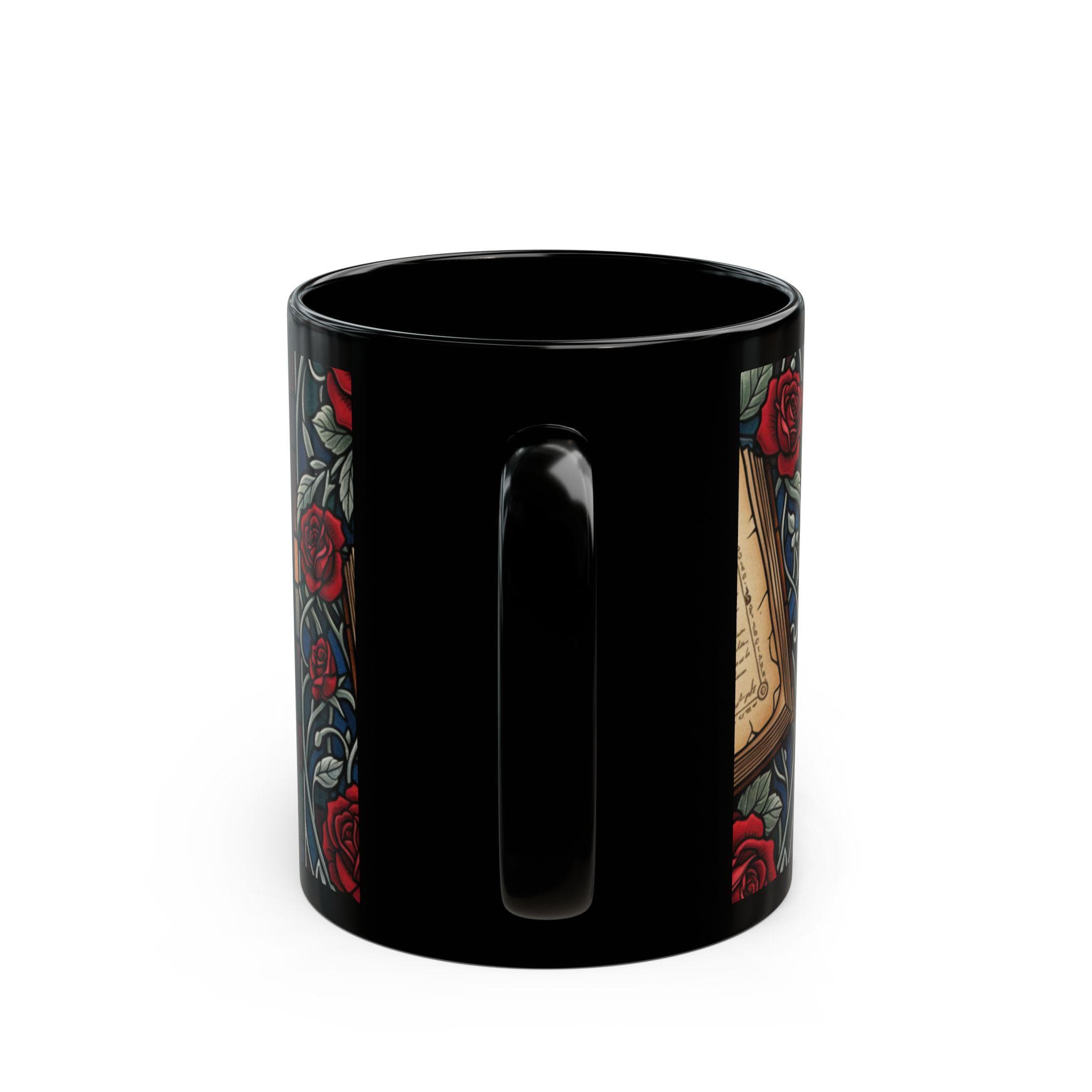 A black mug with a floral design on the side, featuring red roses and other colorful elements.