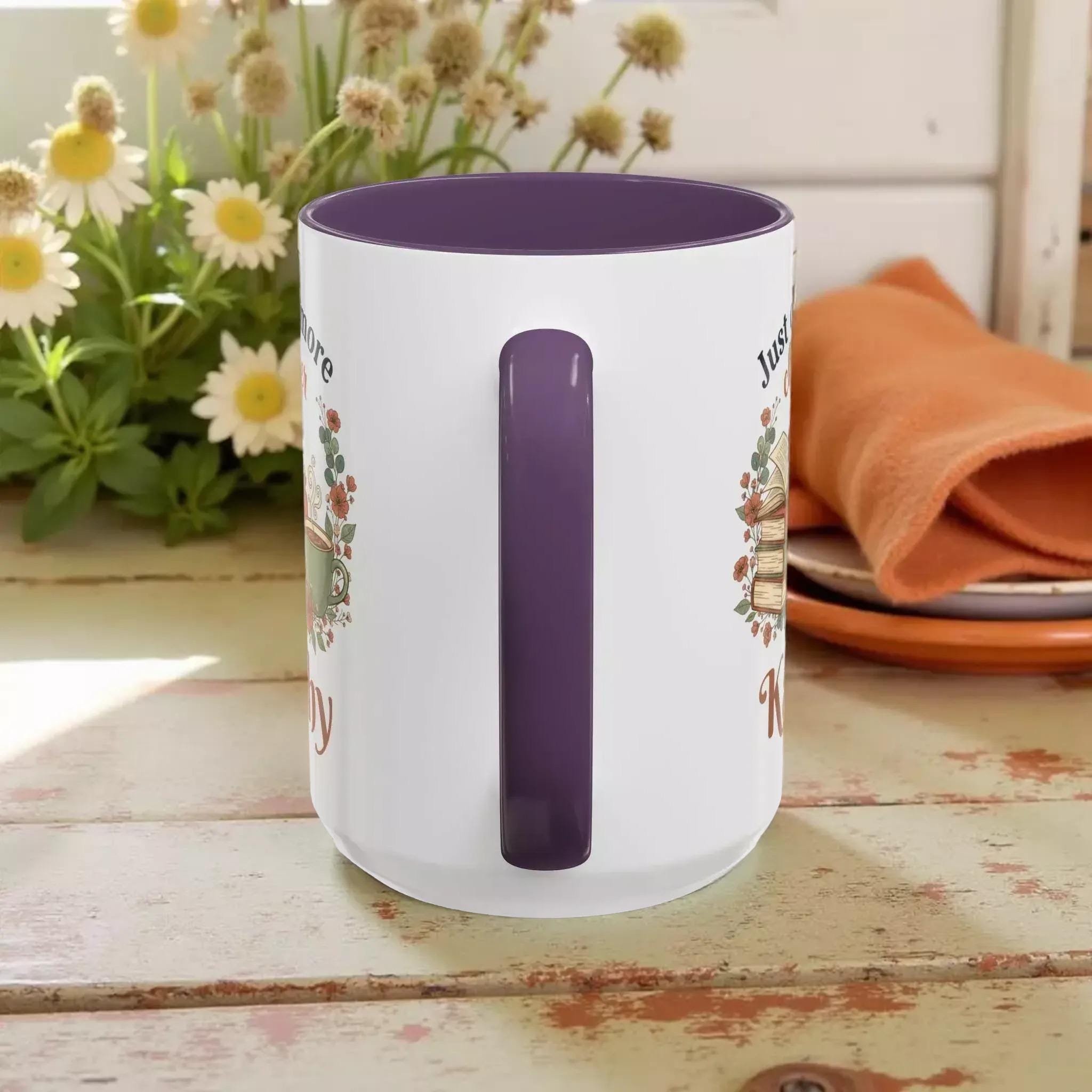 A white mug with a purple interior, featuring a floral design and the text "Just love knitting".