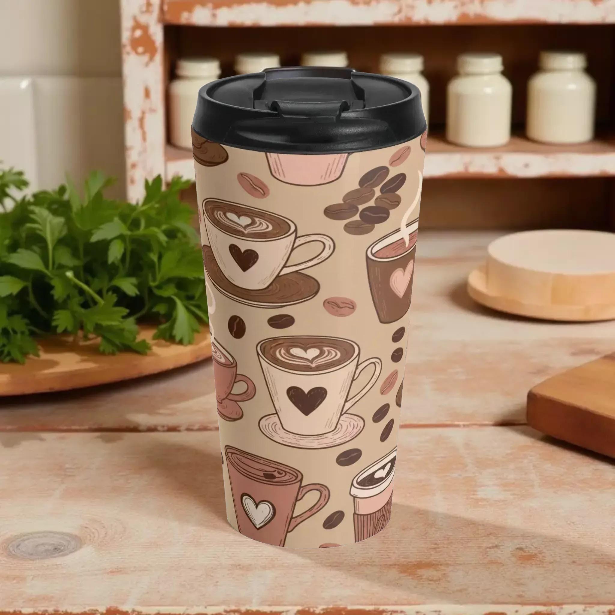 A tall, cylindrical coffee mug with a black lid and a pattern of coffee cups and coffee beans printed on it.