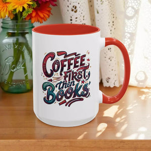 A white mug with a red rim, featuring a colorful and stylized text design that reads "Coffee first then books".