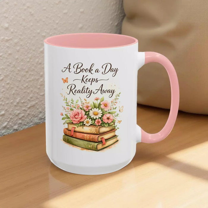 A white mug with a black handle, featuring a design of a stack of books with flowers on top.