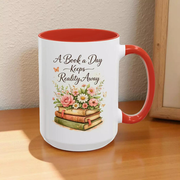 A white mug with a black handle, featuring a design of a stack of books with flowers on top.