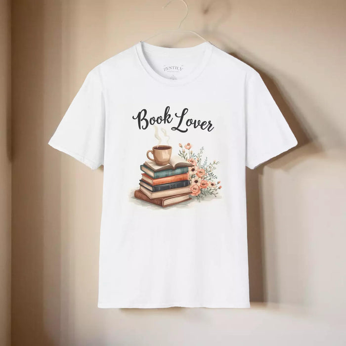 A beige t-shirt with a printed design that includes a cup of coffee, a stack of books, and flowers. The text on the t-shirt says "Book Lover".