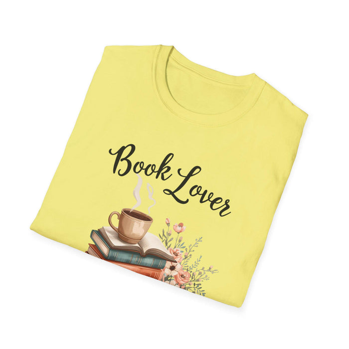 A beige t-shirt with a printed design that includes a cup of coffee, a stack of books, and flowers. The text on the t-shirt says "Book Lover".