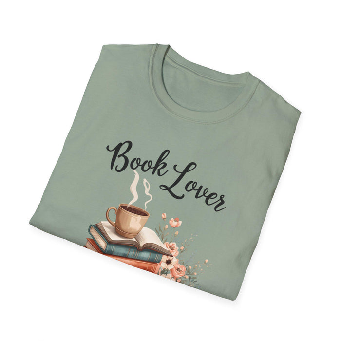A beige t-shirt with a printed design that includes a cup of coffee, a stack of books, and flowers. The text on the t-shirt says "Book Lover".