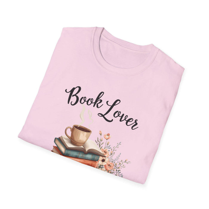 A beige t-shirt with a printed design that includes a cup of coffee, a stack of books, and flowers. The text on the t-shirt says "Book Lover".