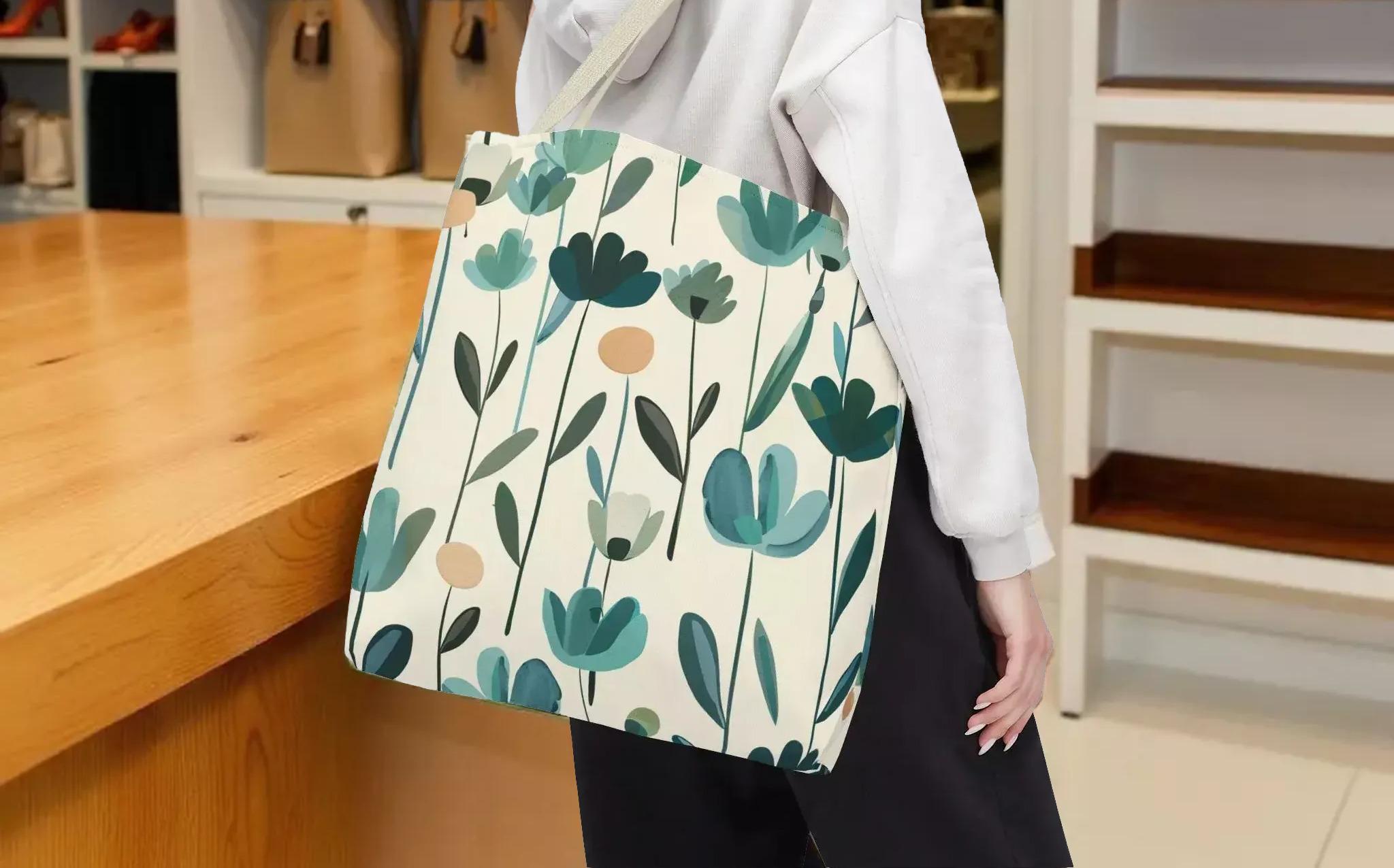 A person is standing in front of a wooden counter, holding a bag with a floral pattern on it.