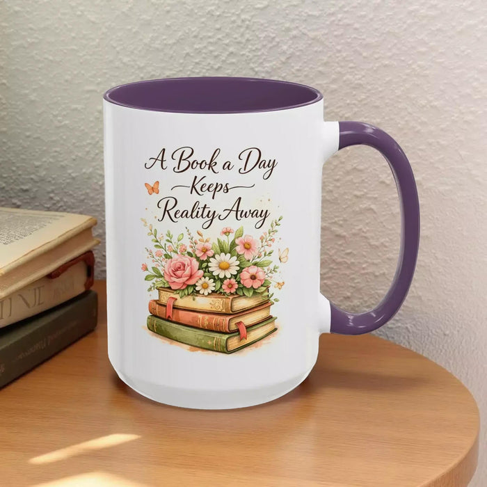 A white mug with a black handle, featuring a design of a stack of books with flowers on top.