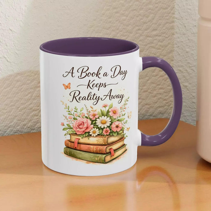 A white mug with a black handle, featuring a design of a stack of books with flowers on top.