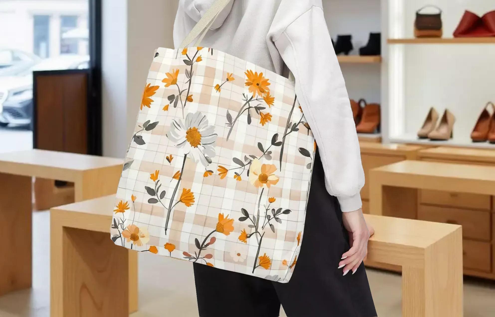 A person is standing in a store, holding a floral tote bag with a pattern of orange and white flowers.