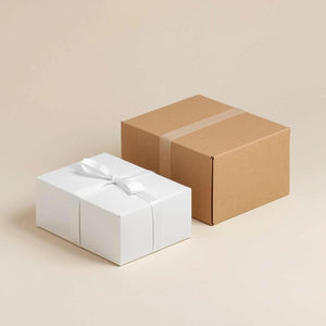 Two gift boxes, one white and one brown, are placed side by side against a light background.