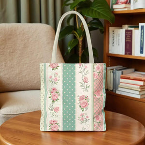 A tote bag with a floral pattern in shades of green, pink, and white.
