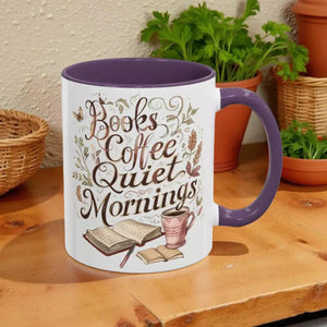 A white mug with a purple handle, featuring a design with the text "Books Coffee Quiet Mornings" and illustrations of a book, a cup of coffee, and a plant.