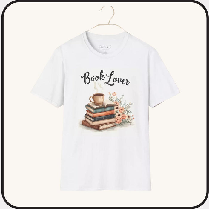 A beige t-shirt with a printed design that includes a cup of coffee, a stack of books, and flowers. The text on the t-shirt says "Book Lover".