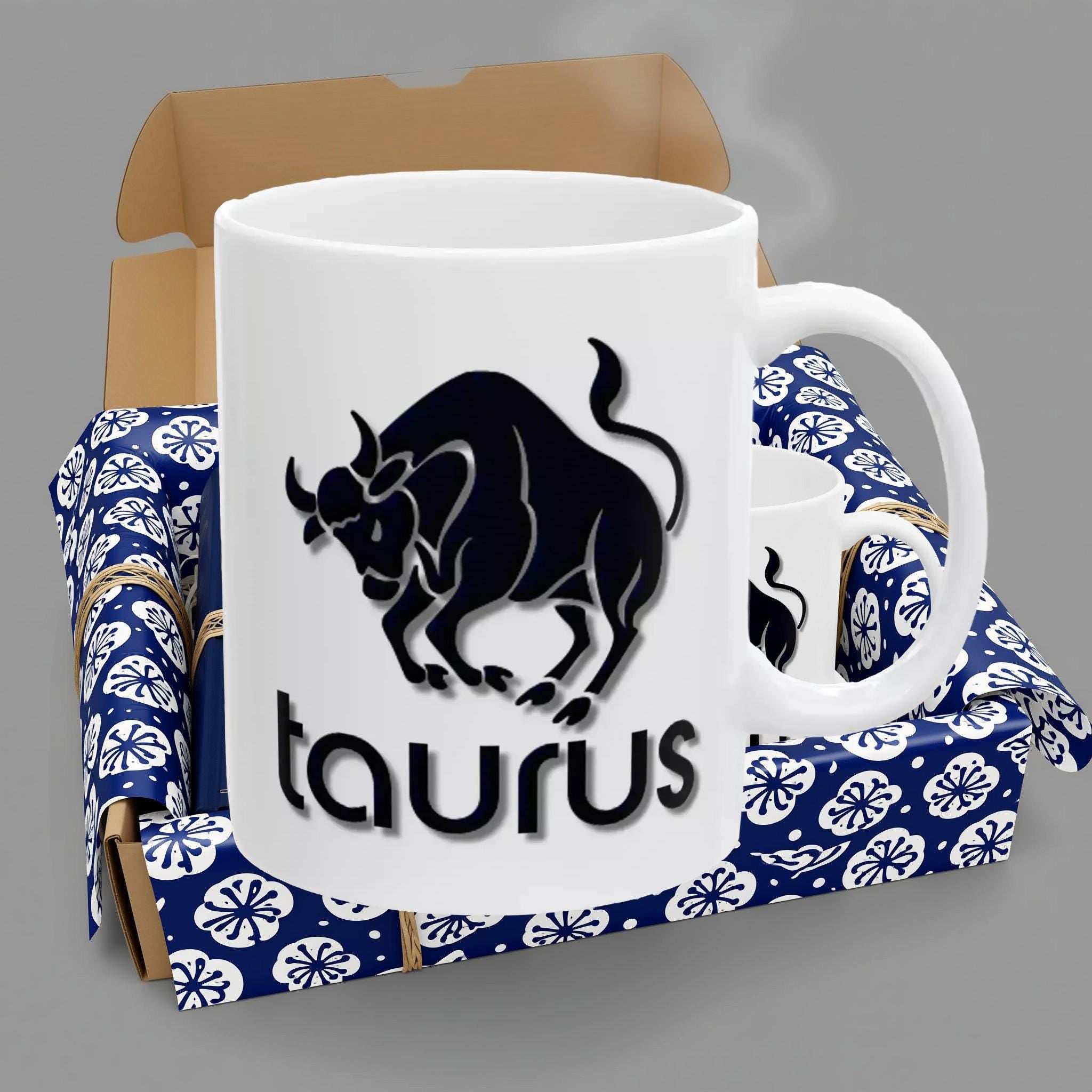 A white ceramic mug with a black silhouette of a bull and the word "taurus" printed on it.