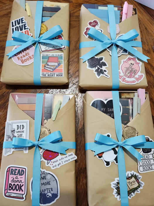 A collection of wrapped books and reading materials, including a "Blind Date With a Book Bundle" that includes 12 curated books and extra items, presented in a visually appealing manner.