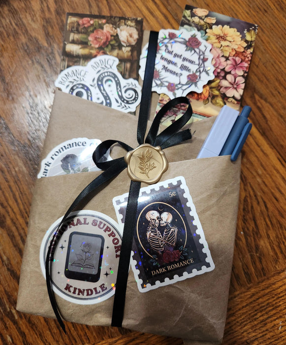 a gift set consisting of a tote bag, a mug, and a candle, all with the text "Blind Date with a Book" printed on them.