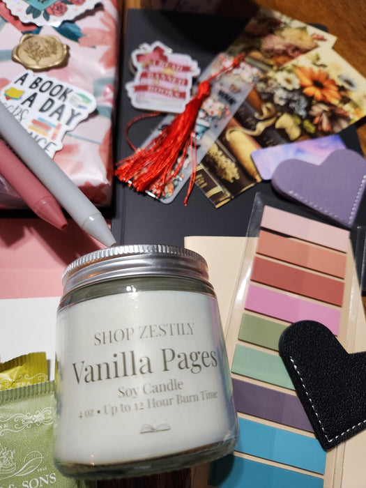 A box containing various items, including a book, snacks, candles, and other miscellaneous items, all wrapped in brown paper and tied with twine.