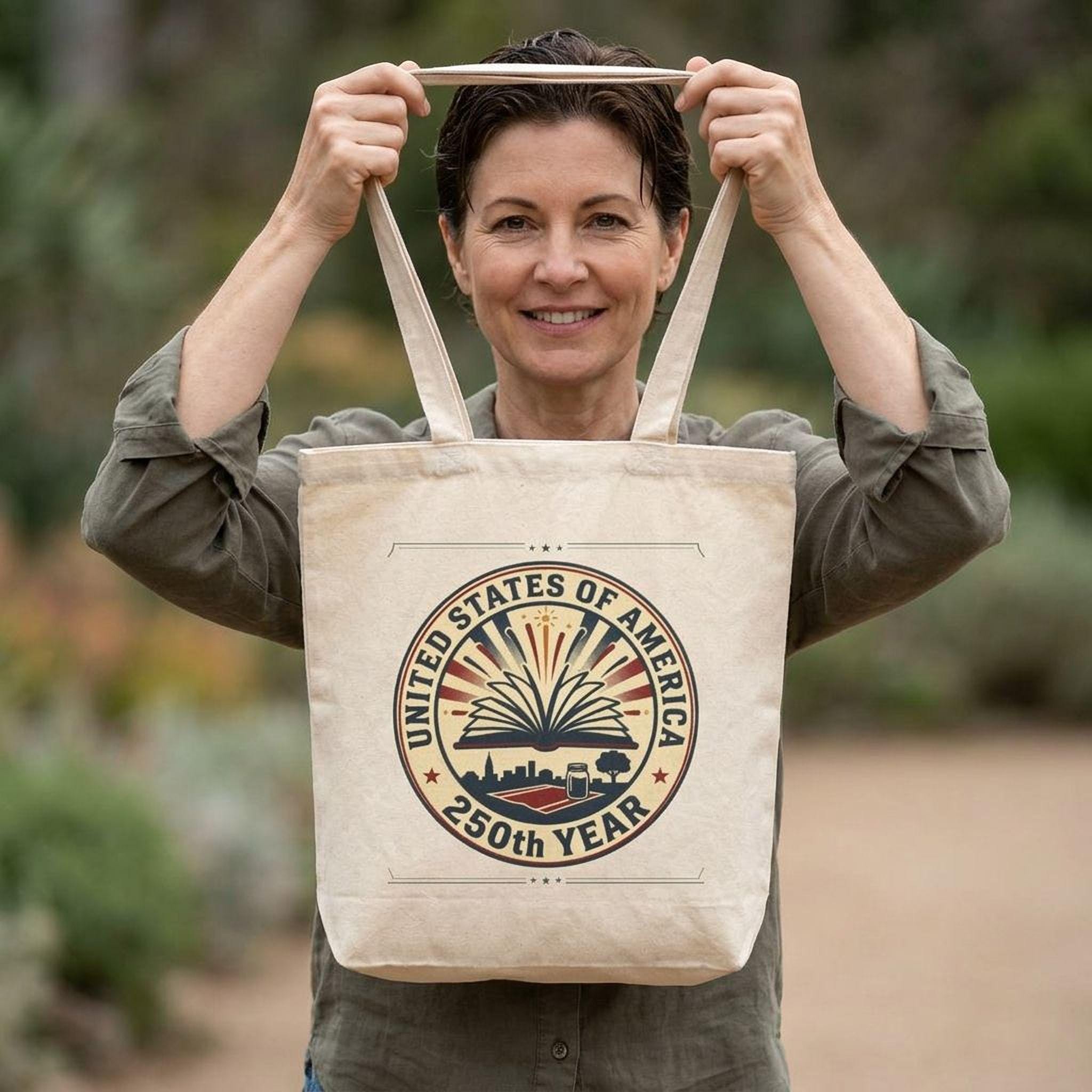 A woman holding a beige tote bag with a circular design that says "United States of America 250th Year".