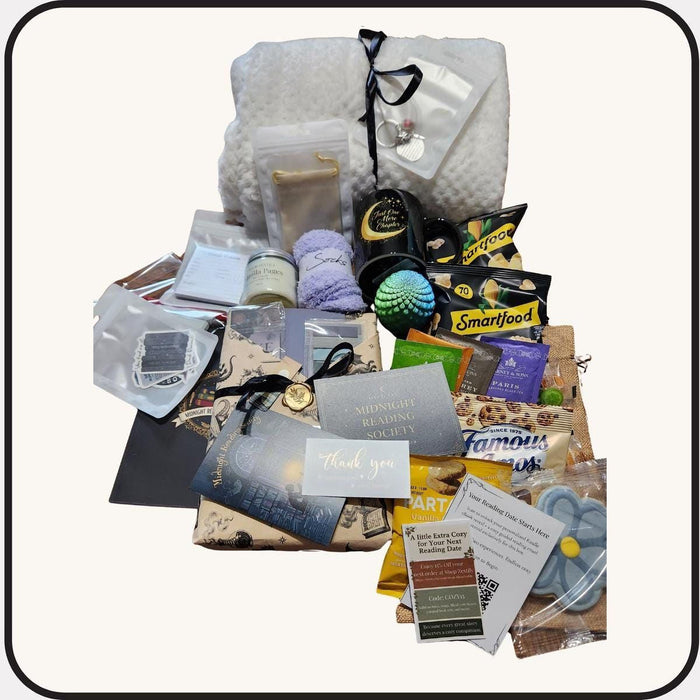 various items related to the "Dark Academia" theme, including a book, a mug, a candle, and other miscellaneous objects.