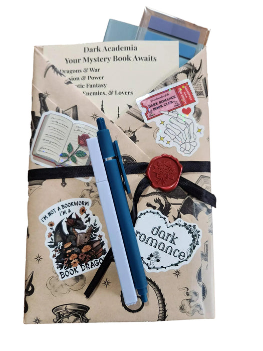 various items related to the "Dark Academia" theme, including a book, a mug, a candle, and other miscellaneous objects.