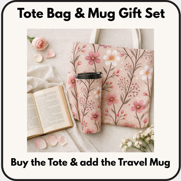 A tote bag with a floral pattern and a travel mug are displayed on a table, along with a book and some rose petals.