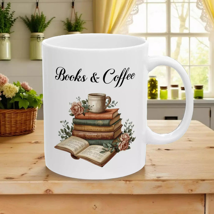 A white tote bag with a printed design of a stack of books and a cup of coffee, placed on a wooden table in a living room setting.
