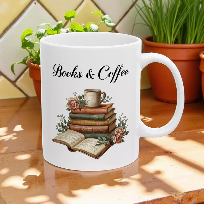 A white tote bag with a printed design of a stack of books and a cup of coffee, placed on a wooden table in a living room setting.