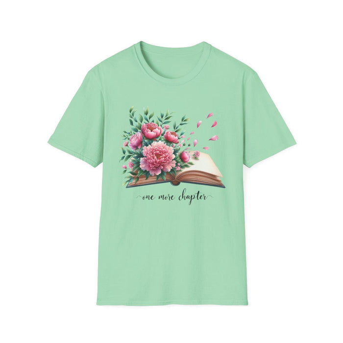 A smiling woman wearing a t-shirt with a floral design and the text "one more chapter" is sitting on a wooden chair.