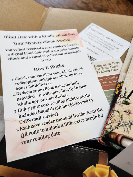 a box of books with a phone and a cup of coffee