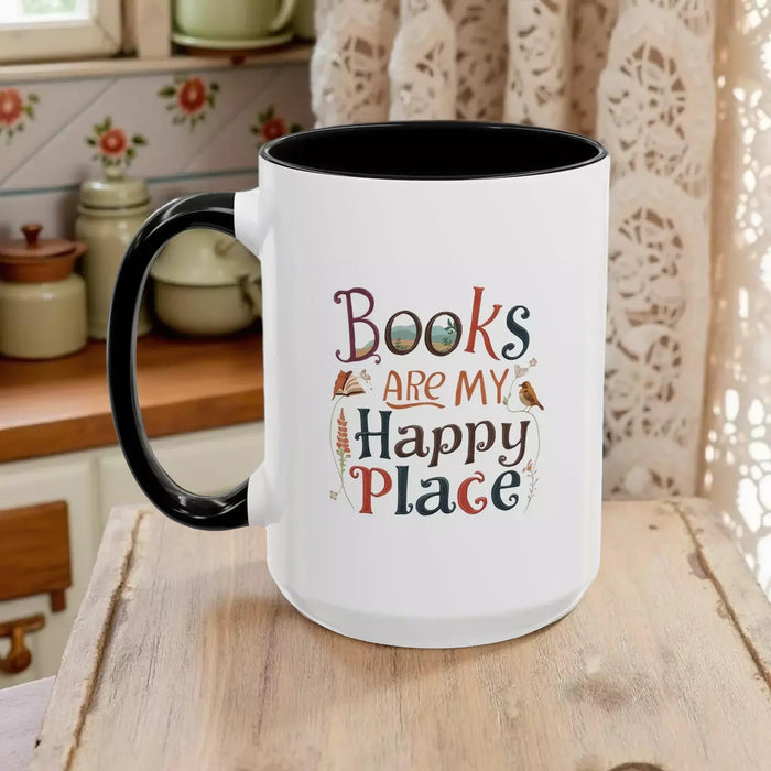 A tote bag and a mug with the text "Books are my Happy Place" printed on them, along with a book and a pen.