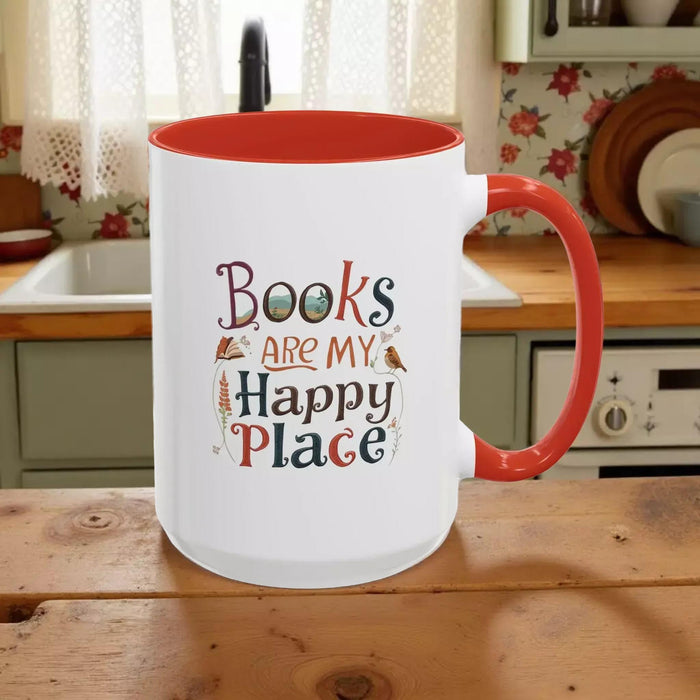 A tote bag and a mug with the text "Books are my Happy Place" printed on them, along with a book and a pen.