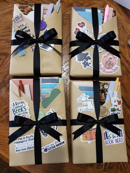 A collection of wrapped books and reading materials, including a "Blind Date With a Book Bundle" that includes 12 curated books and extra items, presented in a visually appealing manner.