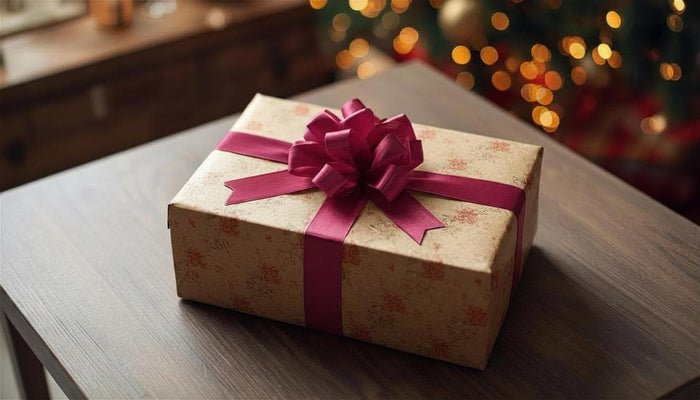 The image is a gift set consisting of a book, a mug, and a candle, with a tag that reads "For You".