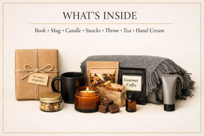 a Father's Day gift set, including a book, a candle, a coffee cup, a blanket, and other items arranged on a table.