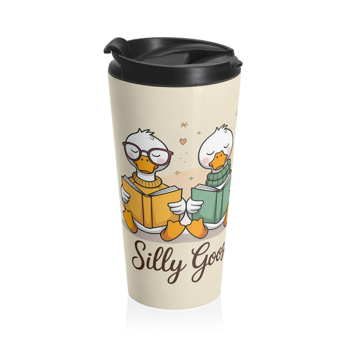 A tote bag and a travel mug with a design featuring cartoon ducks and the text "Silly Goose Book Club" are displayed on a wooden table.