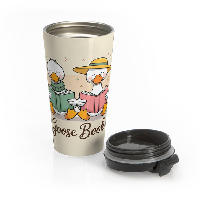 A tote bag and a travel mug with a design featuring cartoon ducks and the text "Silly Goose Book Club" are displayed on a wooden table.