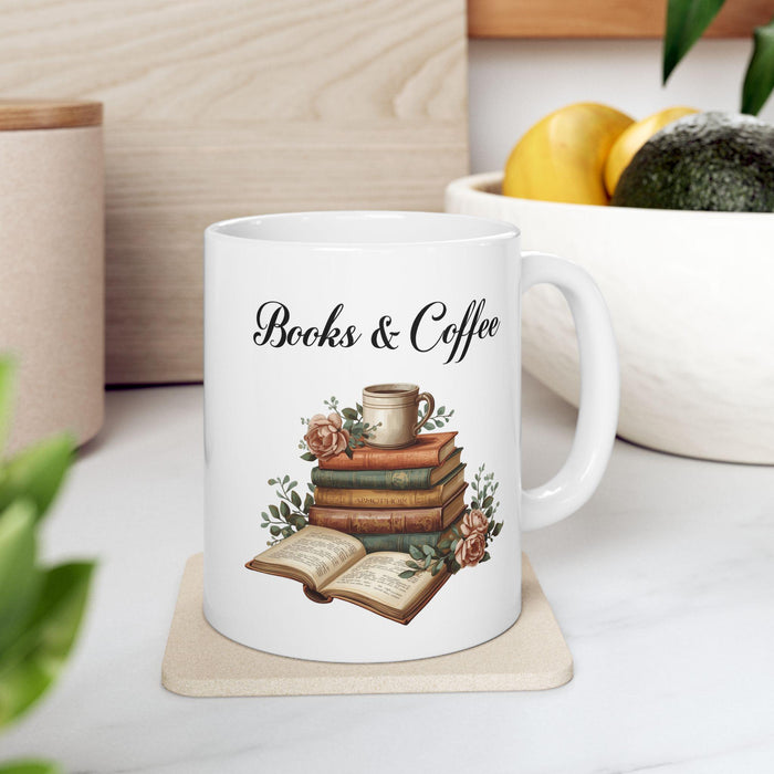 A white tote bag with a printed design of a stack of books and a cup of coffee, placed on a wooden table in a living room setting.